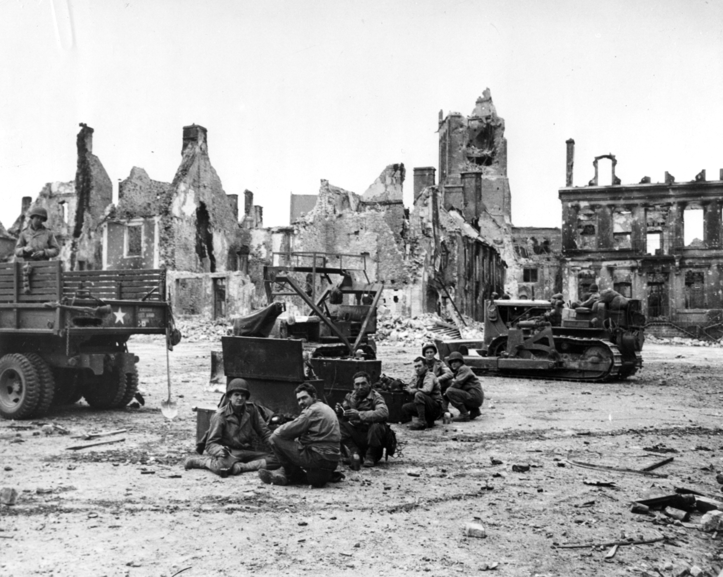 Americans at work preparing Cherbourg for operations. These men are likely Navy Sea Bee (Construction Battalion) personnel, who specialized in heavy machinery operation and construction work. (U.S. Navy) Americans at work preparing Cherbourg for operations. These men are likely Navy Sea Bee (Construction Battalion) personnel, who specialized in heavy machinery operation and construction work. (U.S. Navy)